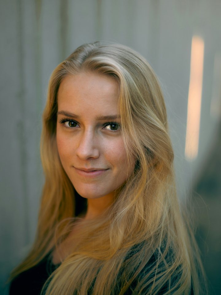 Sarah Edwards, the persona: a young woman with long fair hair, smiling slightly.
